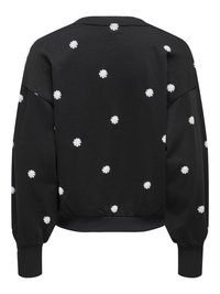 Black sweatshirt with round neckline and long, puffed sleeves. Features scattered white daisy embroidery. Ribbed cuffs and hem. Smooth texture.