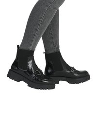 Rieker Bottines à plateau - schwarz