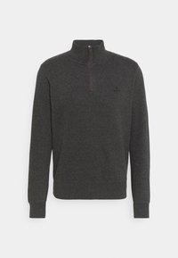 Tmavě šedý fleecový pulovr s polozipem, žebrovanými manžetami a pasem. Na hrudi má decentní logo. Měkká textura.