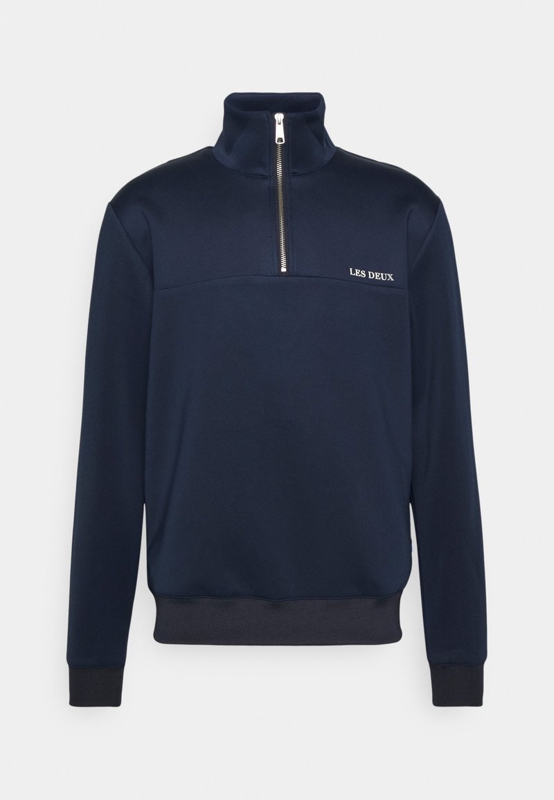 Sweat-shirt bleu marine à demi-fermeture éclair avec col montant, poignets et ourlet côtelés, et logo "LES DEUX" sur le côté gauche de la poitrine.