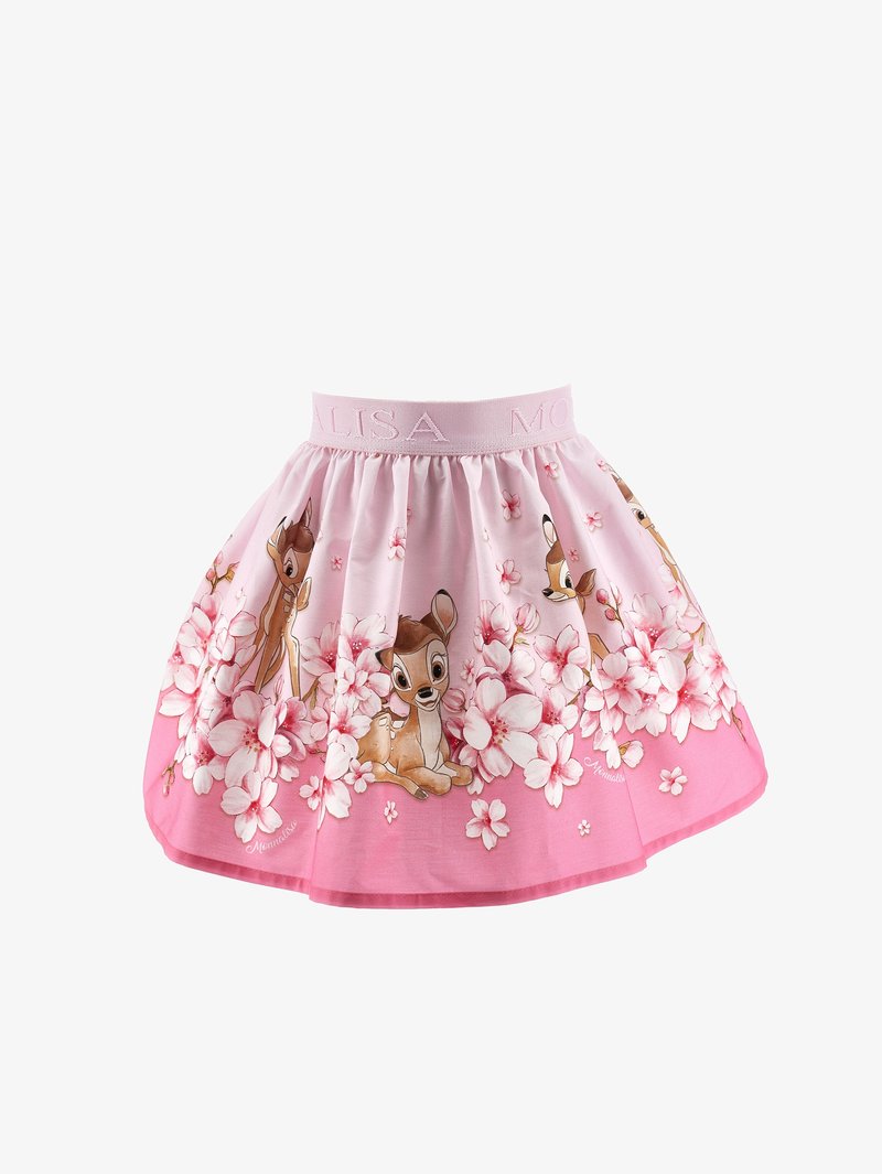 Falda rosa con una cinturilla ancha que presenta el texto "MALISA", adornada con ciervos de dibujos animados y patrones florales a lo largo del dobladillo. Material de algodón.