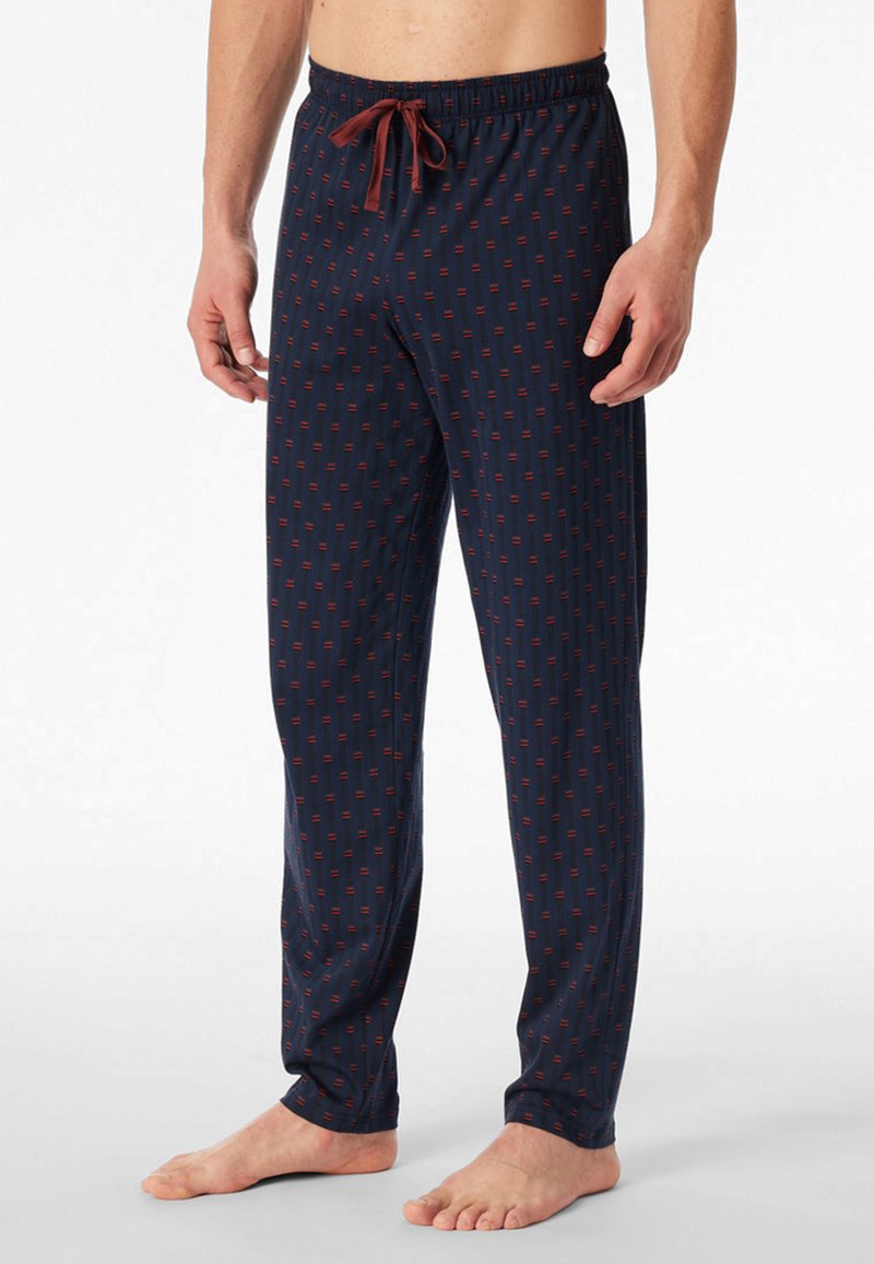 Pantaloni da pigiama blu navy con un motivo geometrico rosso ripetuto, dotati di una vita elastica con un fiocco frontale e un design a gamba dritta.