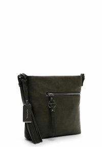 Olive green leather crossbody bag featuring a zippered front pocket, tassel accent, and a circular hardware detail. Smooth texture, compact design.