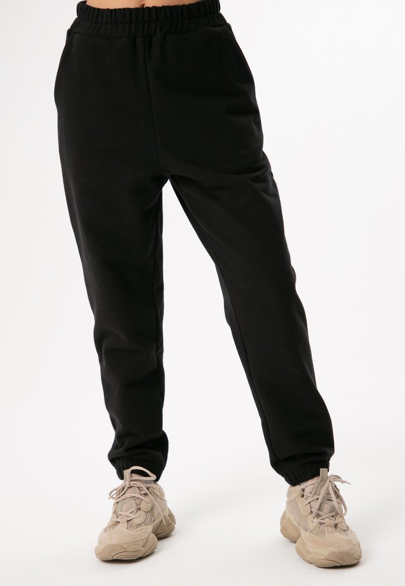 ET NOS Tracksuit bottoms black Zalando.de