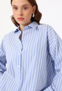 Modanisa BENIN niebieski