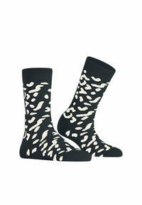Zwarte sokken met een crème abstract patroon, gemaakt van een zachte stof, met een lengte tot de kuit en elastische boorden voor een veilige pasvorm.