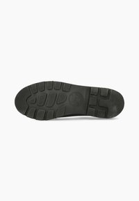Semelle de chaussure en caoutchouc noir avec des motifs de semelle texturés et un logo circulaire. Forme arrondie avec des arêtes prononcées pour une adhérence et une stabilité accrues.