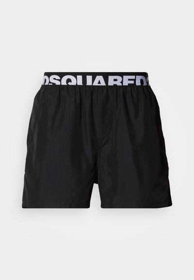 Bañador corto negro hecho de material ligero, con cintura elástica con texto de logo en blanco y un ajuste relajado.