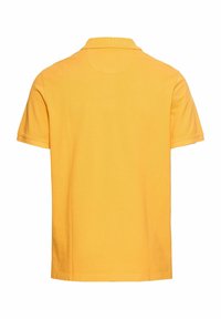 Geel polo shirt met korte mouwen, klassieke kraag, katoenen textuur en rechte zoom, met een glad, effen kleurontwerp.