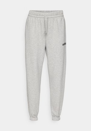 Grijze joggingbroek van zacht materiaal, met een elastische tailleband met trekkoord, afgewerkte manchetten en een zwart logo op de linker dij.