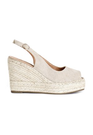 Sandali con zeppa beige, con tomaia in tessuto texturizzato, punta aperta e design slingback. Suola in juta stile espadrille con dettagli intrecciati.