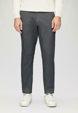 Gray textured trousers with a tailored fit, straight leg design, and front pockets, paired with white sneakers.
