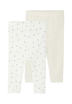 Zwei Paare Baby-Leggings; eines weiß mit kleinen schwarzen Herzmustern, das andere beige mit einem schlichten Design.