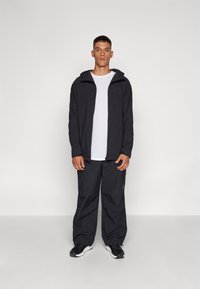 Ellesse BUSTED PANT - Bukse - black