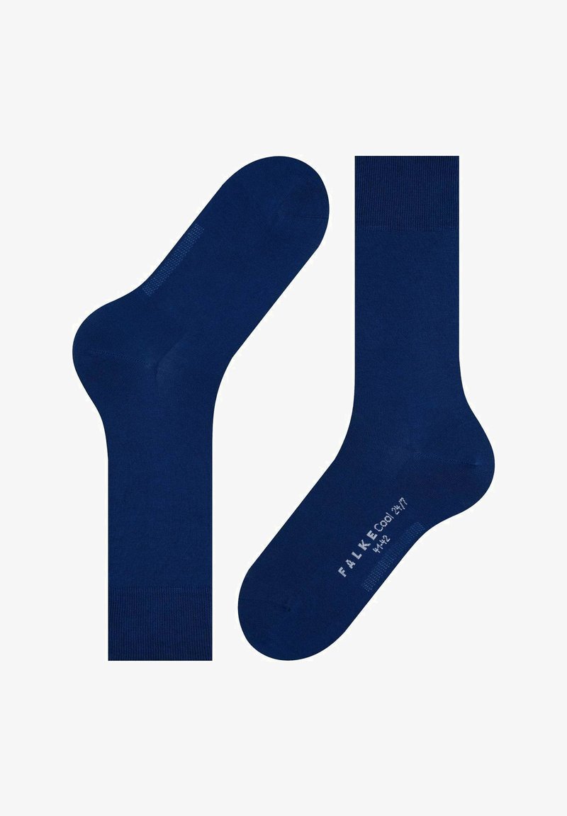 Calcetines de algodón azul marino con una textura suave, que cuentan con puntera y talón reforzados, y un logotipo impreso en la suela. Longitud estándar de media caña.