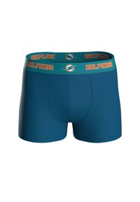 Troncos de baño en color azul verdoso hechos de un tejido elástico, con una cinturilla elástica verde que lleva el texto y el logo "Dolphins" en acentos naranjas y azul verdoso.