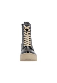 Baskets montantes en cuir noir avec des lacets beiges, fermeture éclair sur le côté et une épaisse semelle beige. Finition brillante et tige texturée.