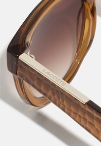Lacoste Óculos de sol - transparent caramel