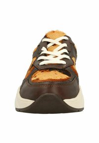 Brown leather sneaker with orange fur accents, white laces, and black textured outsole. Features varying textures and a rounded toe design.