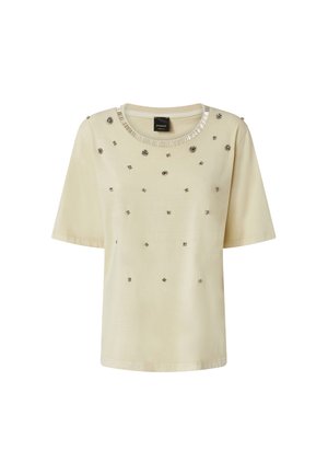 Bež majica kratkih rukava s ukrašenim detaljima i okruglim izrezom s metalnim naglascima. Glatka tkanina sa raspršenim dekorativnim elementima.