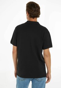 Tommy Jeans Polo - schwarz