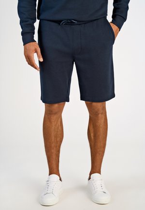 Navyblaue Baumwollshorts mit einem elastischen Bund und einem Kordelzug. Verfügen über Seitentaschen und eine glatte Textur, die über dem Knie enden.