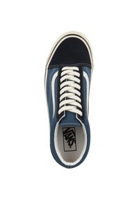 Blue canvas low-top sneaker featuring a dark blue suede toe cap, white leather stripe, and white laces. Rubber sole with contrasting stitching.