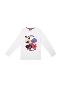 Camicia bianca a maniche lunghe con personaggi dei cartoni animati Ladybug e Cat Noir e la scritta "Sii coraggioso, sii miracoloso" sul fronte.