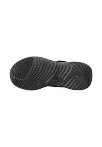 Suela de zapato negra con patrones de tracción ondulados y elevados, además de un logotipo. El material parece gomoso con un acabado texturizado para mayor agarre.
