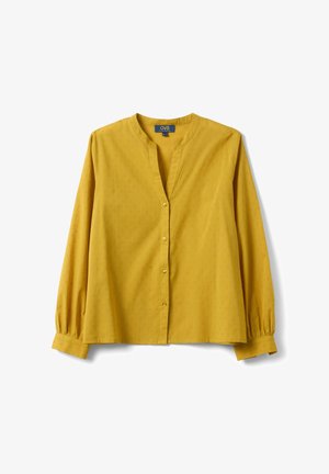 Senfgelbe Bluse mit langen Ärmeln und dezentem Punktmuster, rundem Ausschnitt, vorderer Knopfleiste und gerafften Manschetten.