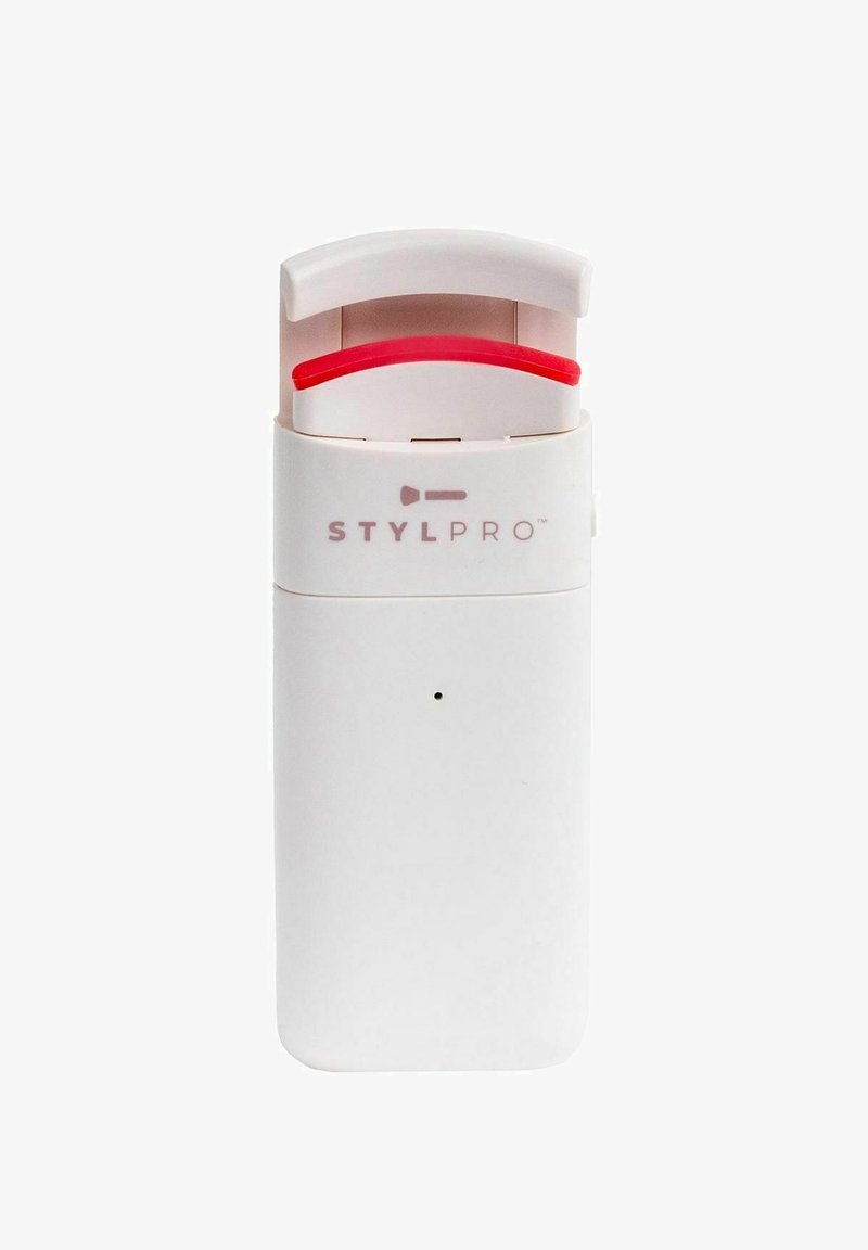 Stylpro-apparaat in wit plastic met een gebogen bovenkant. Bevat een rode accenten en logo aan de voorkant; compact rechthoekig formaat.