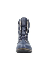 Bottines en cuir bleu marine avec un laçage à l'avant, doublure en fausse fourrure et finition décorative en couture. Semelle plate avec des détails en caoutchouc texturé.