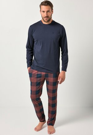 Navy long-sleeve shirt paired with brown and navy checkered pajama pants, featuring a relaxed fit and soft fabric. No shoes worn.