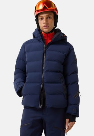 Granatowa pikowana kurtka z kapturem, wyposażona w elastyczne mankiety, kieszenie na zamek i błyszczący zamek błyskawiczny. Ciepła, pikowana konstrukcja.