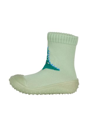 Light green knitted baby sock with a rubber sole and grip dots, featuring a blue and green dinosaur design on the side.