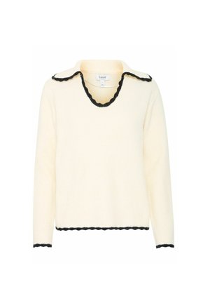 Suéter crema con un cuello y dobladillo negro en forma de ondas, con mangas largas y un diseño de escote en V. Hecho de un material suave y texturizado.