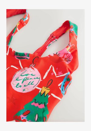 Red swimsuit with festive design, featuring Christmas ornaments, stars, and a decorated tree in vibrant colors. Smooth, stretchy fabric.