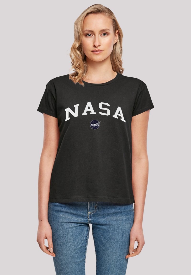 Black cotton t-shirt featuring white "NASA" lettering, short sleeves, a round neckline, and a circular NASA logo in blue.
