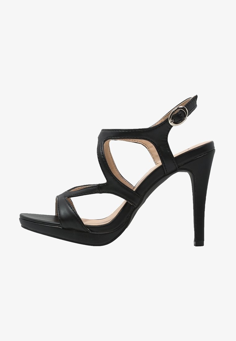 Sandale noire à talons hauts en cuir avec un design ajouré, une bride réglable à la cheville et une semelle compensée. Caractérisée par une forme élégante et moderne.