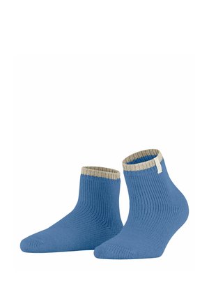 Blaue Knöchelsocken mit gerippter Textur und einem kontrastierenden beigen Bündchen. Weiches Material mit einer körpernahen Form, geeignet für legere Outfits.