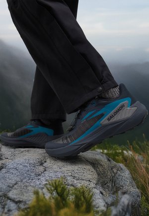 Salomon GENESIS - Zapatillas de trail running - carbon/tahitian tide/quiet shade
