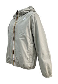 Giacca a vento leggera beige con zip frontale, zip di colore a contrasto, cappucci e polsini elasticizzati. Presenta tasche laterali e un logo.