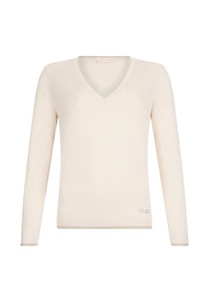 Vaaleanbeige pitkähihaiset V-kaula-aukolliset neulepusero, valmistettu pehmeästä materiaalista, jossa on resorireunukset hihoissa ja hienovarainen brändilogo vasemmassa alakulmassa.