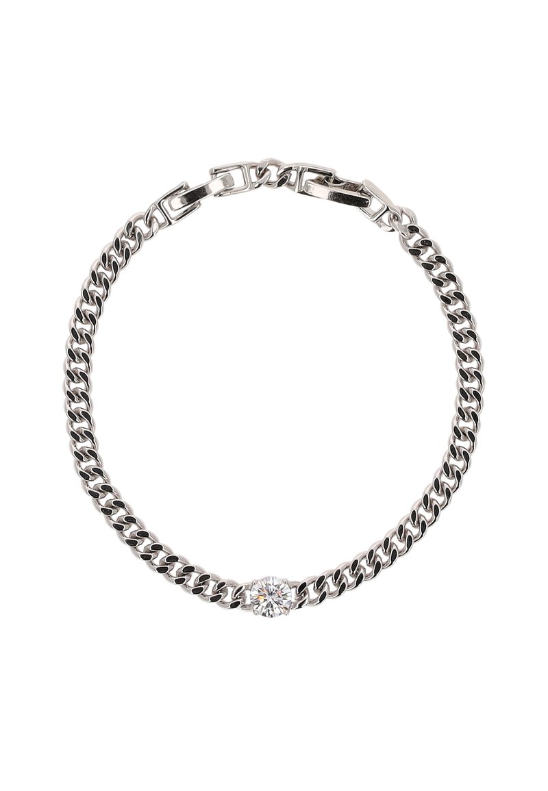 Ezüst színű fém lánc karkötő váltakozó lapos és kerek szemekkel, középen egy átlátszó kő díszítéssel. Simább textúrával és fényes felülettel rendelkezik.