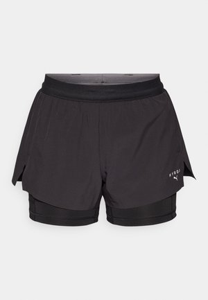 Black running shorts with a layered design, featuring a lightweight outer layer and fitted inner shorts. Includes mesh accents and logo detail.