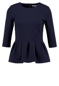 Námořnická modrá peplum blůza s tříčtvrtečními rukávy, kulatým výstřihem a zipem na zádech. Vyrobena z hladkého materiálu s jemnou texturou.