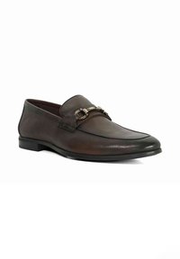 Brown leather loafer with a rounded toe, featuring a decorative metallic chain accent and a low black sole. Smooth texture with subtle shine.