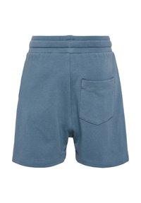 Blå bomullsbyxor med elastisk midja, med en bakficka och en mjuk yta. Lätt lös passform, knälång design.