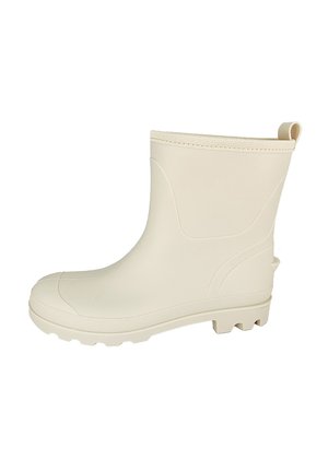 Cream rubber ankle boot with a textured sole, rounded toe, and a pull tab at the back; smooth surface and minimalist design.