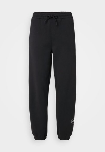 Black sweatpants made of soft fabric, featuring an elastic waistband with a drawstring, cuffed ankles, and a small logo on the lower leg.
